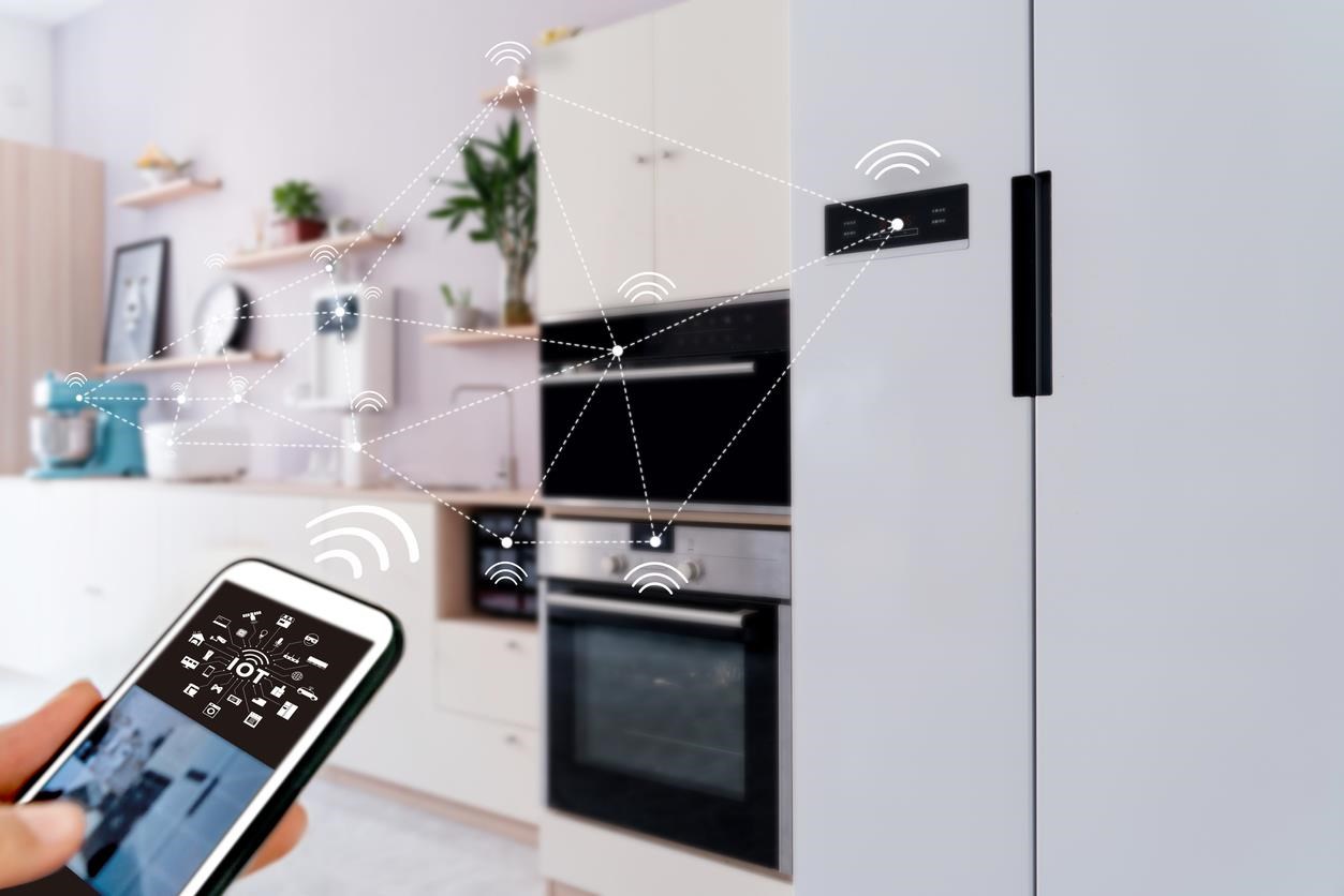 Smart phone controlling other devices in a kitchen. 