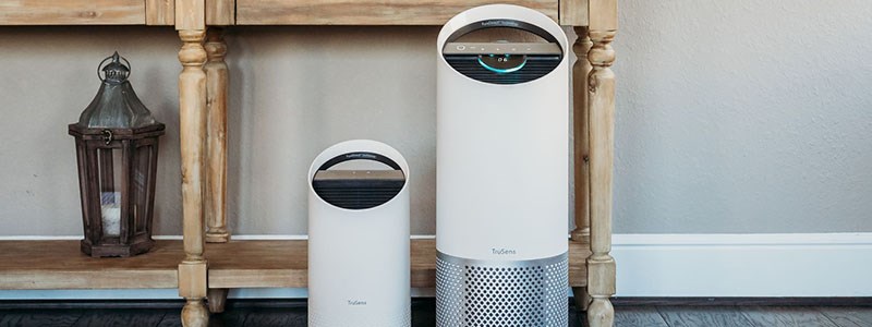 Two TruSens Air Purifiers on the floor of a home. 