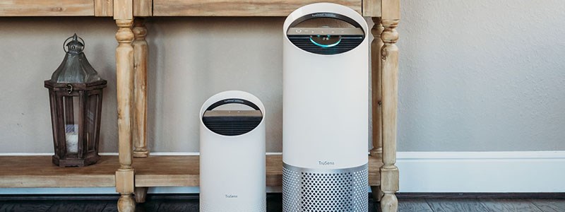 Two TruSens Air Purifiers on the floor of a home.