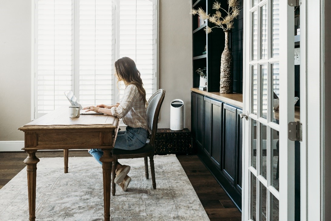 Woman working in a home office. 