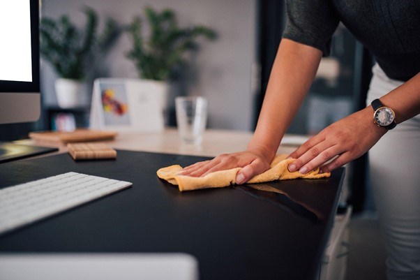 Wiping down an office desk