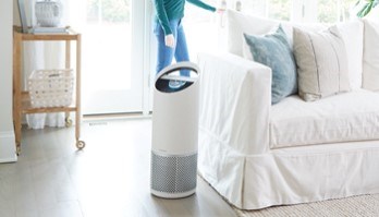 TruSens Air Purifier with a woman in the background 