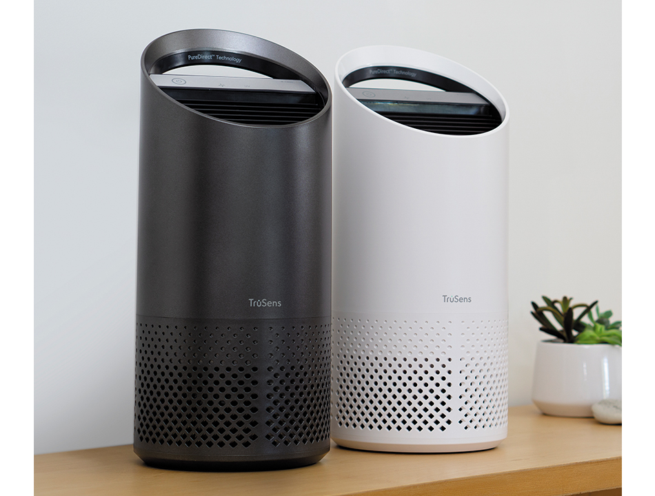 Small White and Charcoal air purifiers sitting next to each other on a table