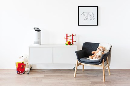A  child's room with toys and a small TruSens Air Purifier. 